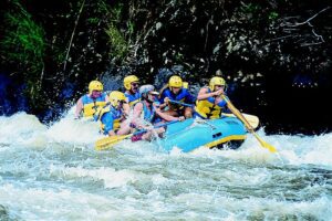 a group of people water rafting