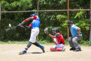 Four kids in a baseball game