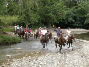 a group of people riding horses