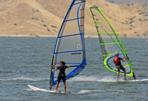 two people windsurfing