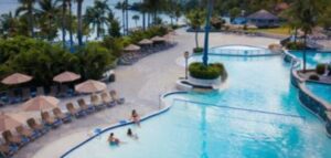 people lounging by the swimming pool