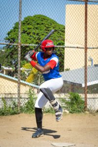 A kid wearing the baseball uniform